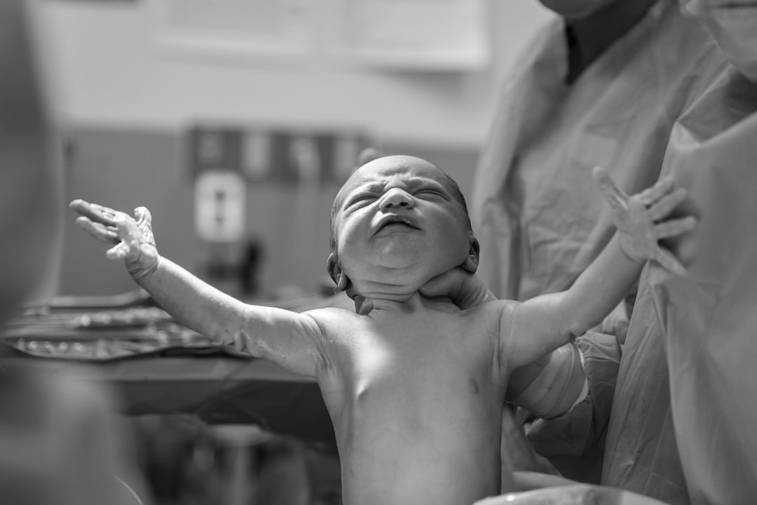 A newborn baby moments after birth: the reason good coverage matters